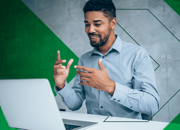 Man talking to a Paycom sales rep on a laptop